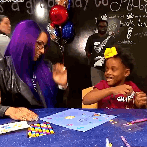 a woman with purple hair talks to a little girl