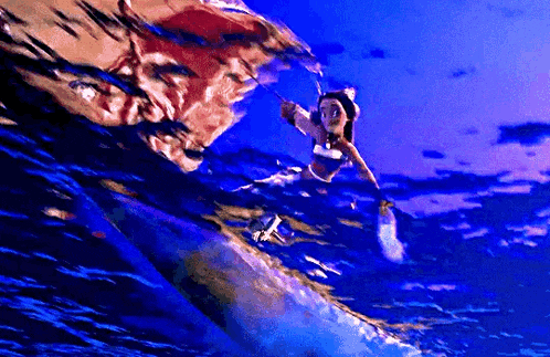 a woman in a bikini is swimming in the ocean with a sword .