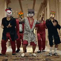 a group of men wearing masks are dancing