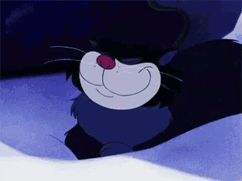 a cartoon cat with a red nose is smiling in the dark