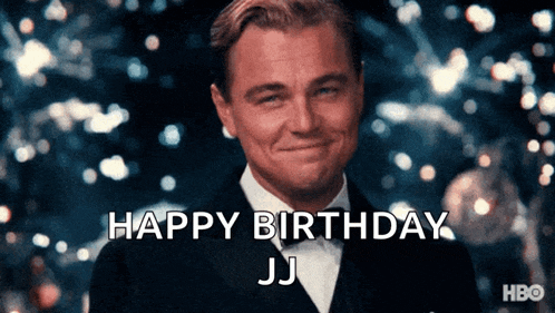 a man in a tuxedo is smiling and says " happy birthday jj "