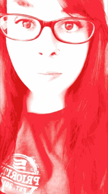 a woman wearing glasses and a shirt that says ' yos tee ' on it