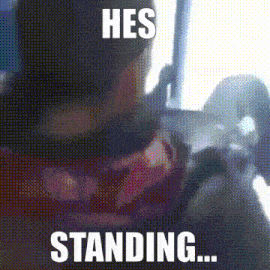 a blurred image of a person with the words he 's standing