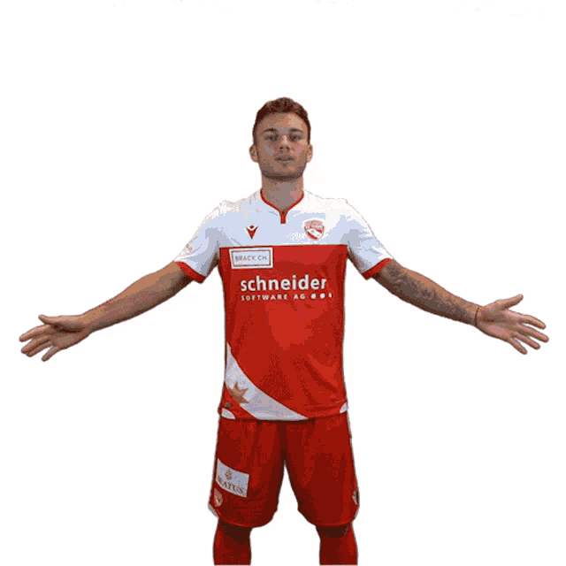 a man wearing a red and white schneider software shirt