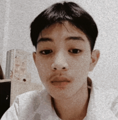 a young man with a mustache and a white shirt looks at the camera