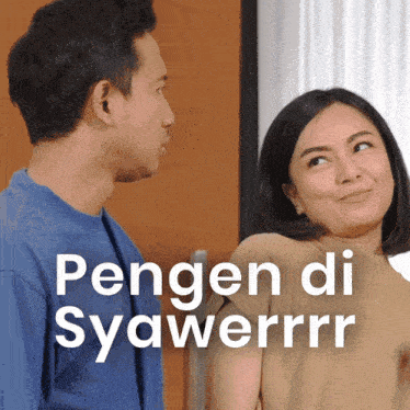 a man and a woman are standing next to each other with the words pengen di syawerrrr on the bottom right