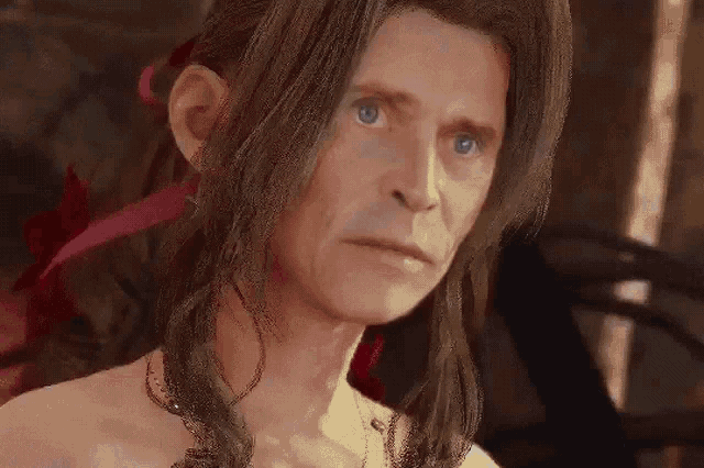 a naked man with long hair and blue eyes looks at the camera