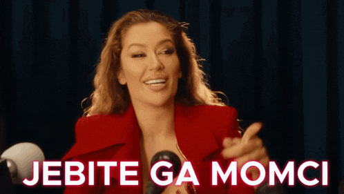a woman in a red jacket is holding a microphone and the words jebite ga momci are next to her