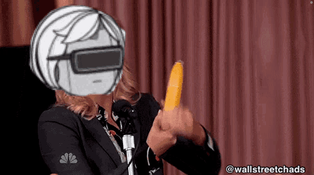 a woman wearing a virtual reality headset holds a banana