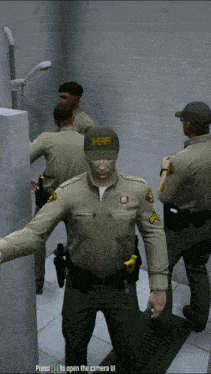 a group of sheriffs are standing in a shower stall