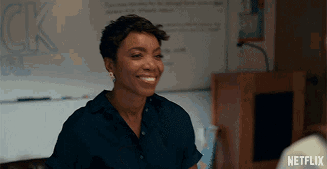 a woman is smiling in front of a white board that says ck