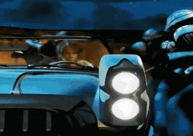 a blue car with the number 8 on the side of it