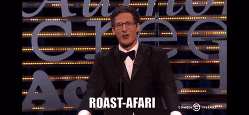 a man in a tuxedo is giving a roast-afari speech on comedy central