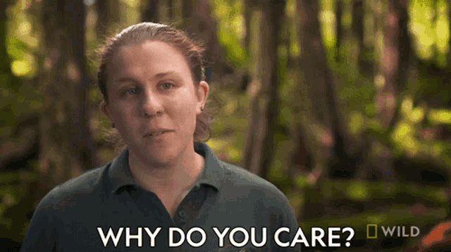 a woman is asking why do you care in front of a forest