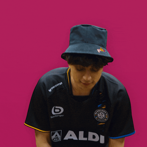 a young man wearing a black hat and a black shirt with the nike logo on it