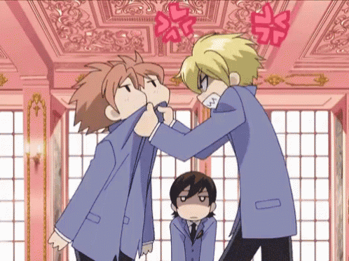 a couple of anime characters are fighting each other in a room