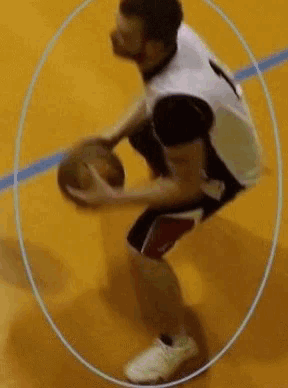 a basketball player with the number 1 on his jersey is dribbling the ball
