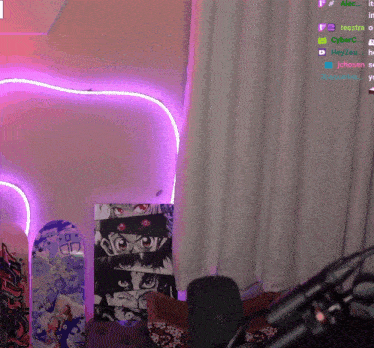 a purple heart shaped light is lit up in a room with skateboards on the floor