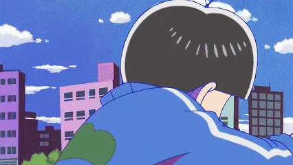 a man in a blue jacket is looking out over a city
