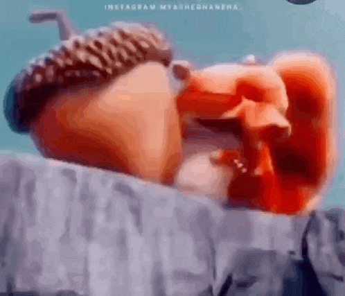 a close up of a cartoon character with a nut on its head