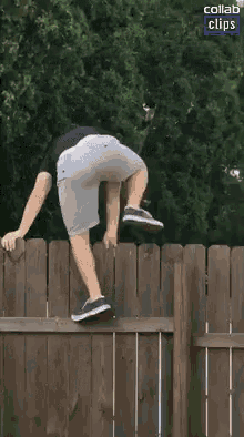 a man is climbing over a wooden fence with a collab clips logo in the corner