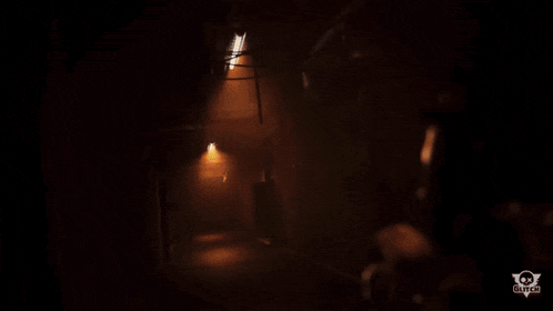 a glowing object in a dark room with the word game on the bottom right