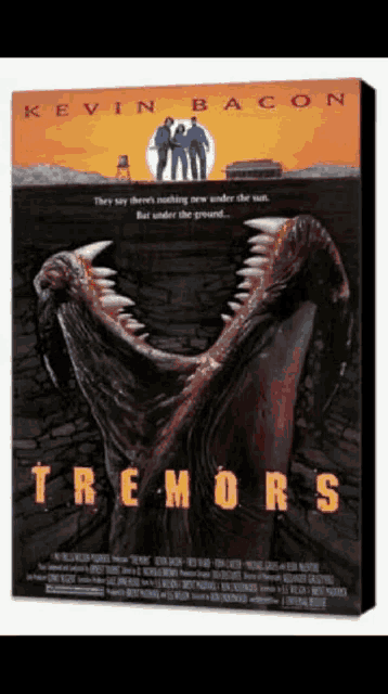 a poster for kevin bacon 's tremors features a monster with its mouth open