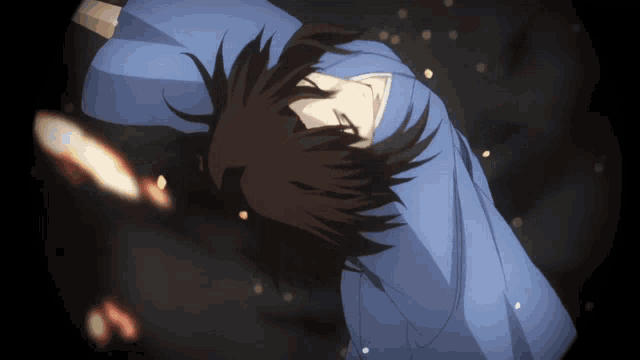 a person in a blue shirt laying on their back