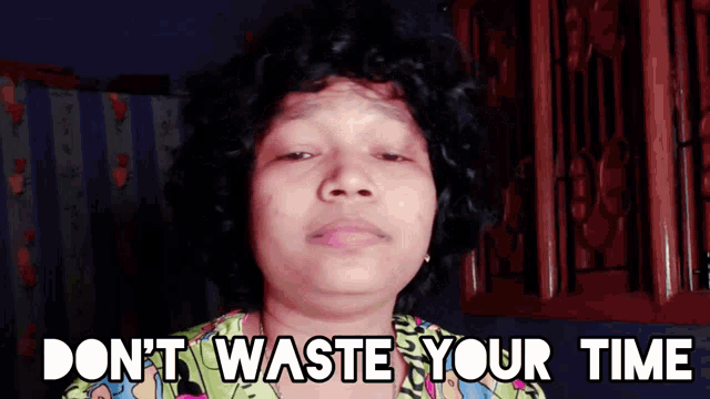 a woman says " do n't waste your time " in front of a cabinet
