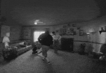 a black and white photo of a family dancing