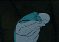 a cartoon frog with orange eyes is looking at the camera
