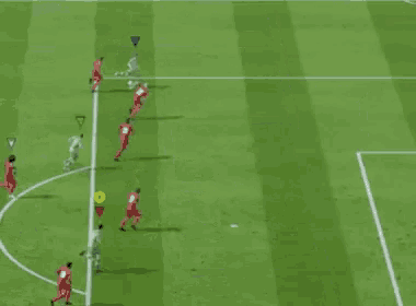 a soccer game is being played on a green field