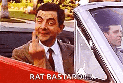 mr bean is giving the middle finger in a car .