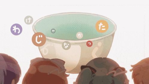 a group of people are looking at a bowl of water with bubbles in it