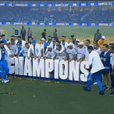 a group of men are holding a banner that says champions
