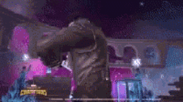 a man in a purple jacket is standing next to a woman in a purple dress in a video game .