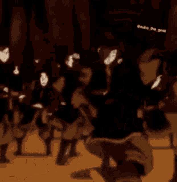 a cartoon of a group of people dancing in a dark room .