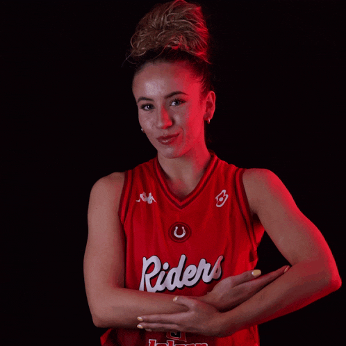 a woman is wearing a red jersey that says riders
