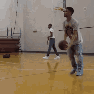 a blurry picture of a basketball court with a few players
