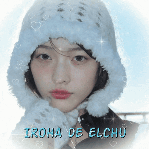 a girl wearing a white hat with the name iroha de elchu on the bottom