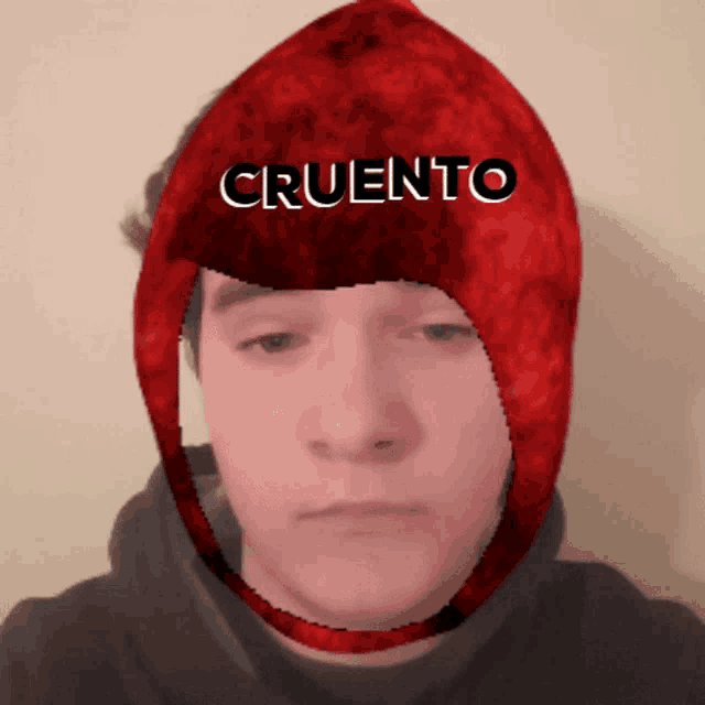 a man wearing a red hat that says cruento