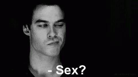 a black and white photo of a man with the words `` sex '' written on the bottom .