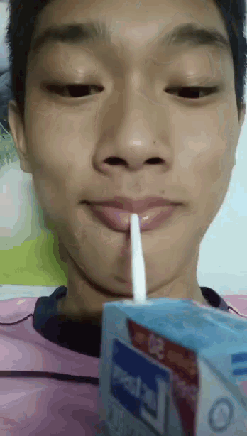 a young man drinking from a carton that says ' mental ' on it