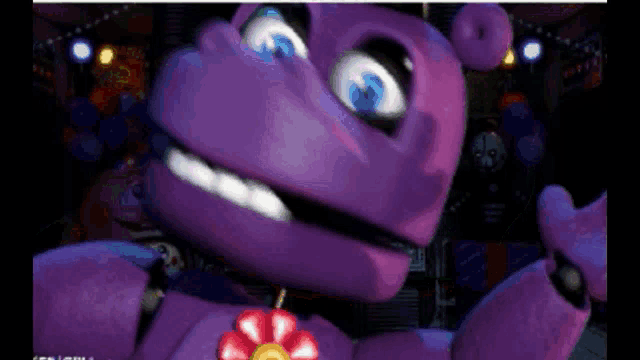 a purple stuffed animal with a red flower on its chest