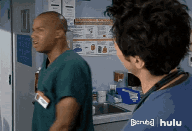 two doctors are standing next to each other in a scrubs hulu ad