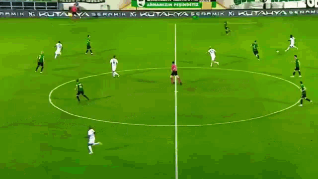a soccer game is being played in a stadium with advertisements for denbank mood and reskin