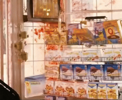 a display of snacks in a store with a sign that says ' a ' on it