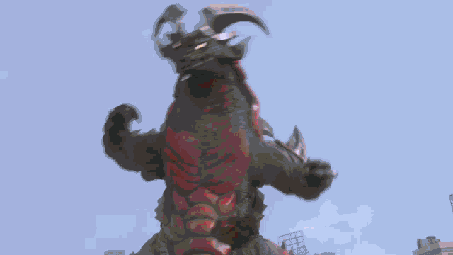 a red monster with horns is standing in the sky with a pink light behind it .