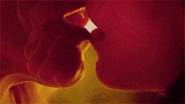 a close up of a woman 's face with a yellow background