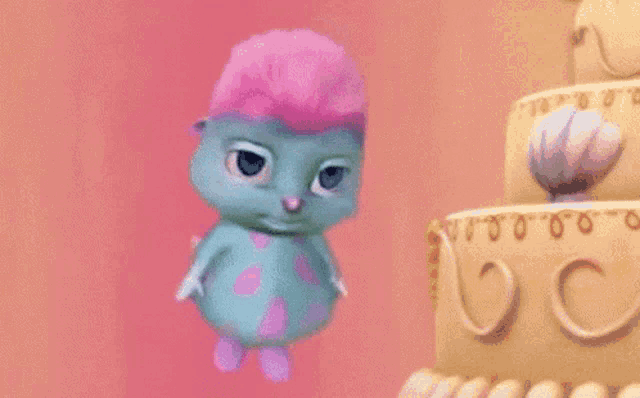 a cartoon character is jumping in the air in front of a cake with the letter c on it